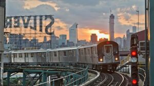subway with nyc skyline in background
